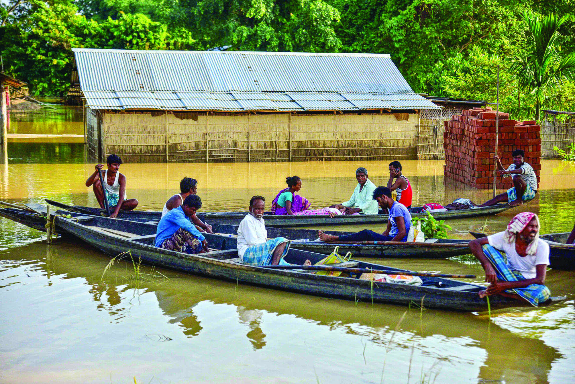 12 more die; Brahmaputra, and Barak continue to rise