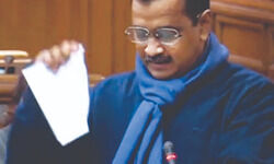 Kejriwal tears copies of Centres farm laws Kejriwal tears copies of Centres farm laws