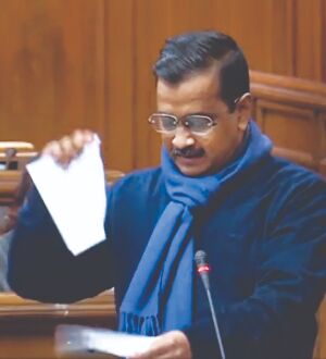 Kejriwal tears copies of Centres farm laws Kejriwal tears copies of Centres farm laws