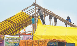 Rain affects medical camps, shelters; farmers set up tent near main stage