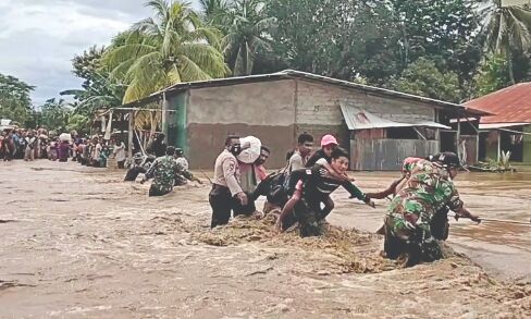 Indonesia landslides, floods kill at least 73 people; dozens missing Indonesia landslides, floods kill at least 73 people; dozens missing