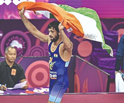 Ravi retains Asian title, Bajrang settles for silver Ravi retains Asian title, Bajrang settles for silver