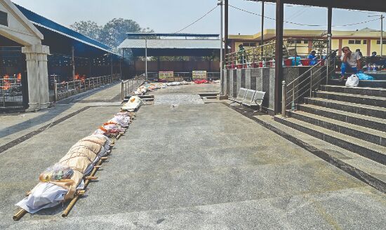 As death toll spirals, corpses wait in   20-hour-long queues at crematoria