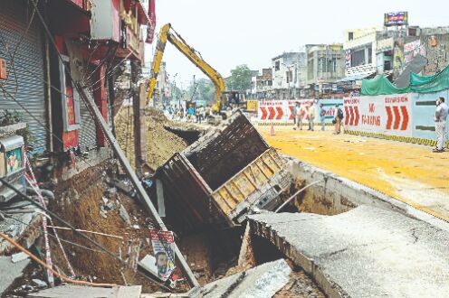Record rain damages roads, buildings, trees; temp down Record rain damages roads, buildings, trees; temp down