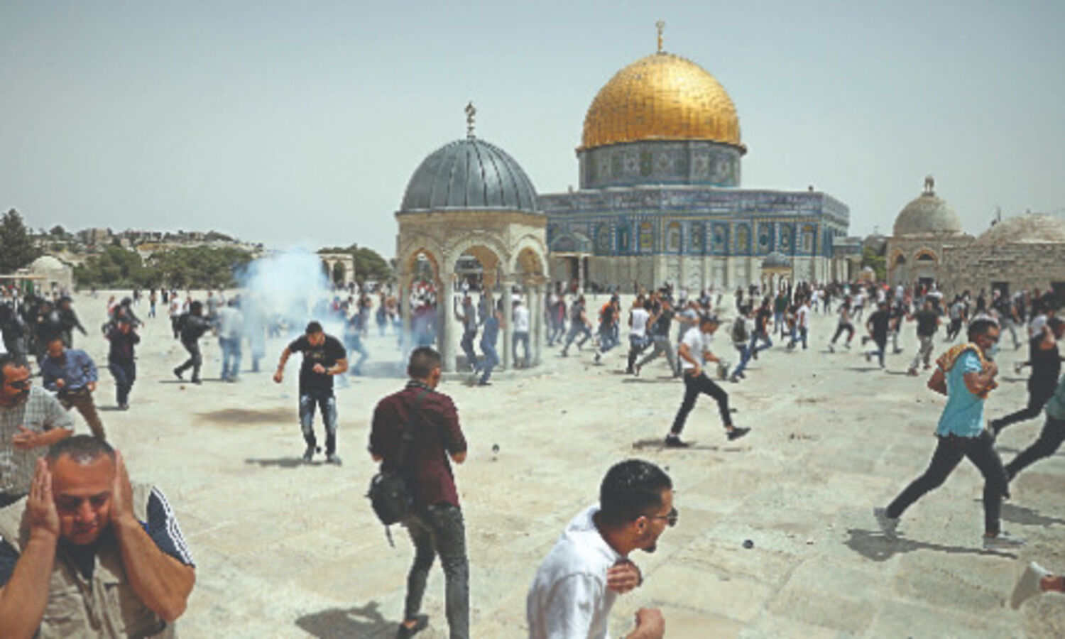 Palestinians see victory in Gaza truce as Israel warns Hamas