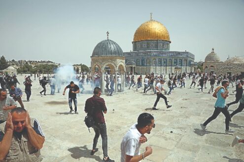 Palestinians see victory in Gaza truce as Israel warns Hamas