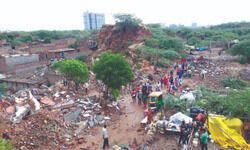 Khori demolition starts, runs into rain, protesting villagers Khori demolition starts, runs into rain, protesting villagers