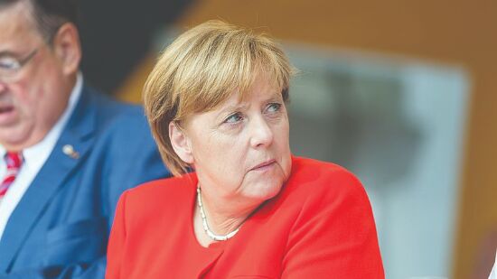 Merkel steps down with legacy dominated by tackling crises