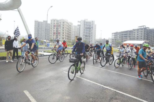 Cyclists ride through New Town to visit pandals Cyclists ride through New Town to visit pandals