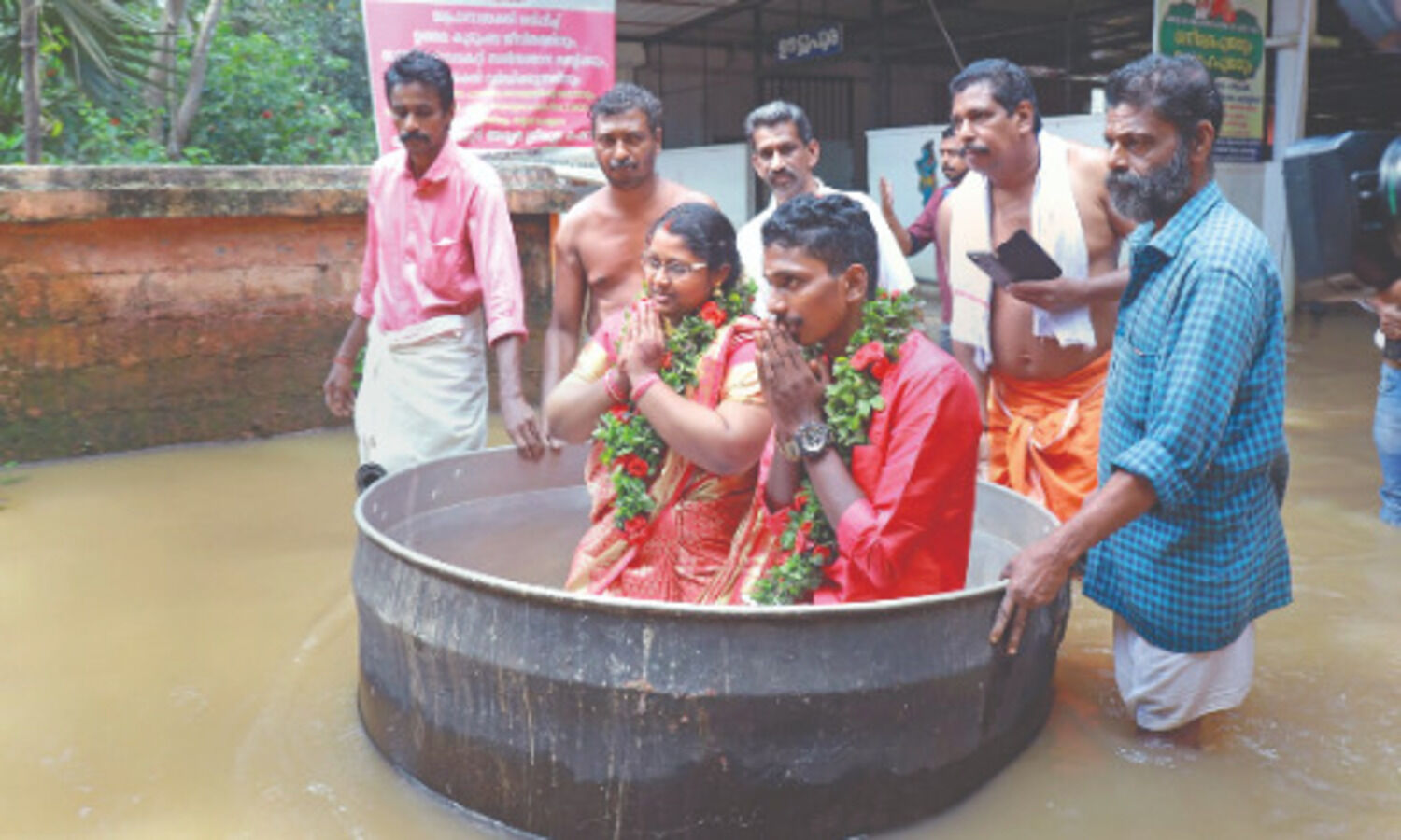 Kerala couple braves flood, sails in a cooking vessel to get hitched