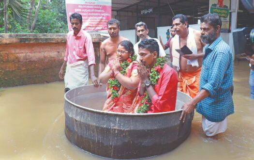 Kerala couple braves flood, sails in a cooking vessel to get hitched