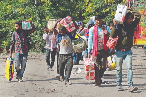 Migrant workers flee Kashmir; throng railway station, bus stands