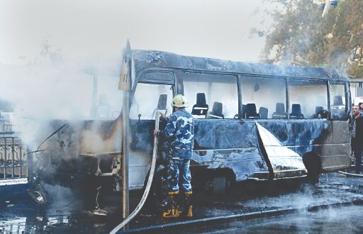 Bus bombs kill 14 in Syria capital; shells elsewhere kill 10 Bus bombs kill 14 in Syria capital; shells elsewhere kill 10