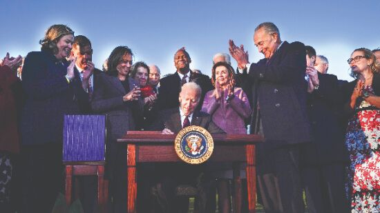 Biden signs $1 trillion infrastructure Bill with bipartisan audience