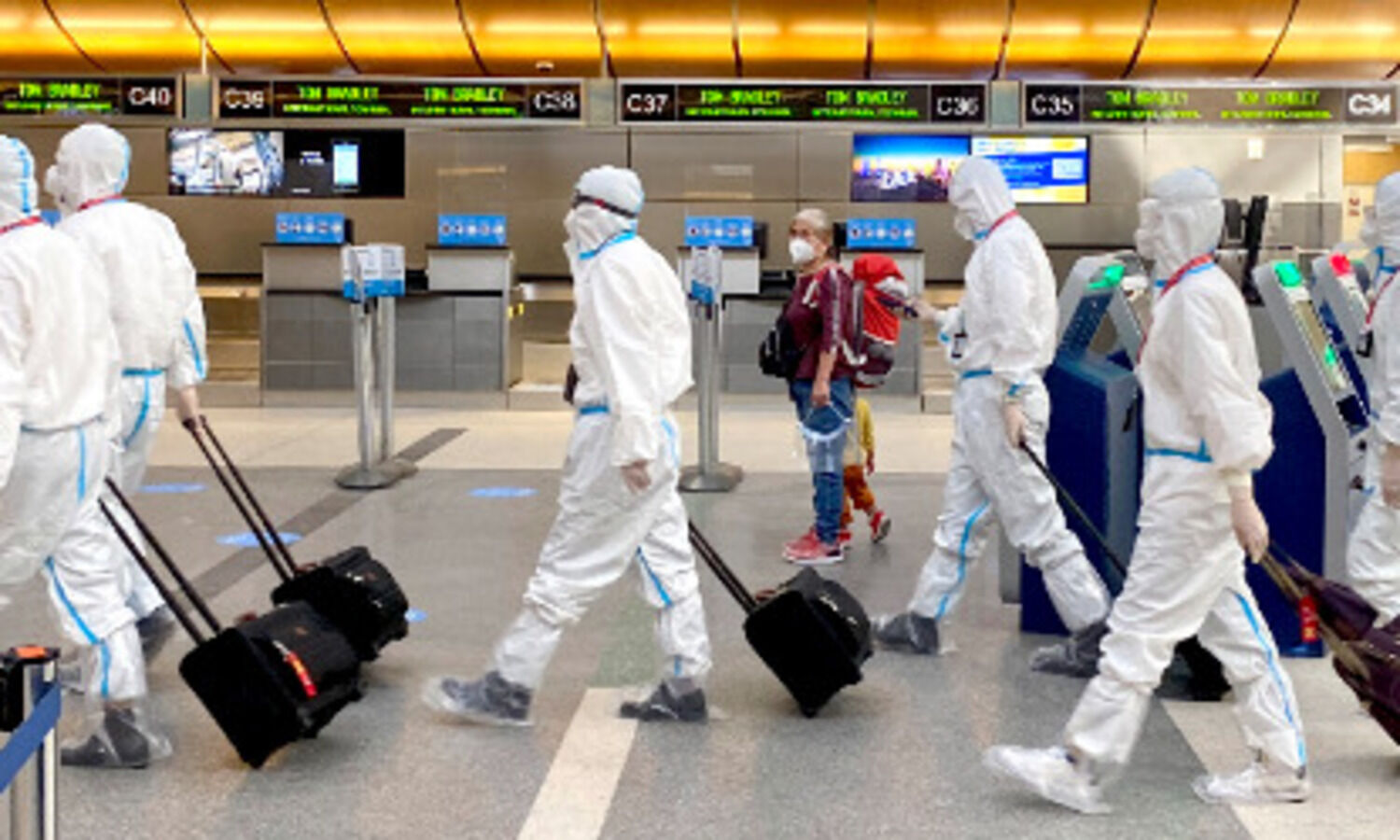 COVID variant spreads to more countries as world on alert