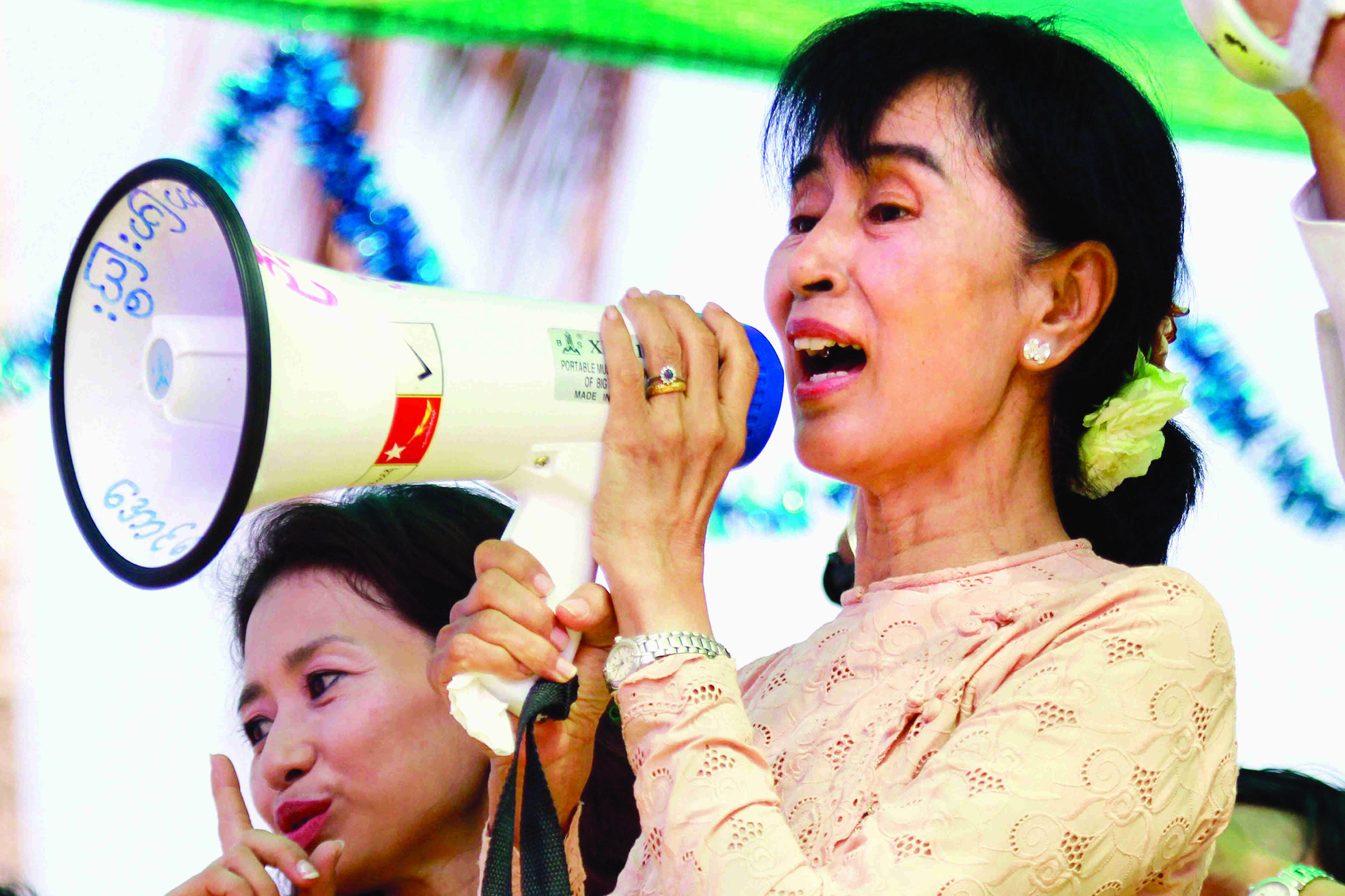 Myanmar junta halves Suu Kyis jail term