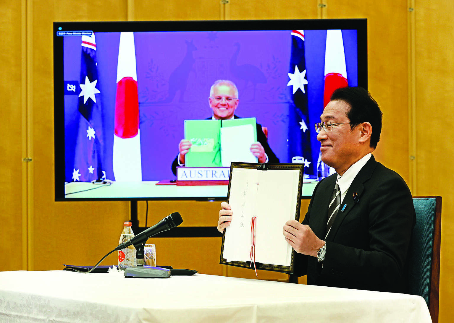 Oz, Japan sign defense pact as China concerns loom Oz, Japan sign defense pact as China concerns loom