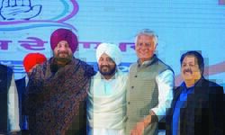 Promises galore in much-delayed manifesto released by Congress Promises galore in much-delayed manifesto released by Congress