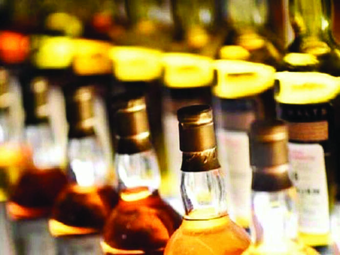 Man uses car with Delhi Police sticker for liquor smuggling, held Man uses car with Delhi Police sticker for liquor smuggling, held