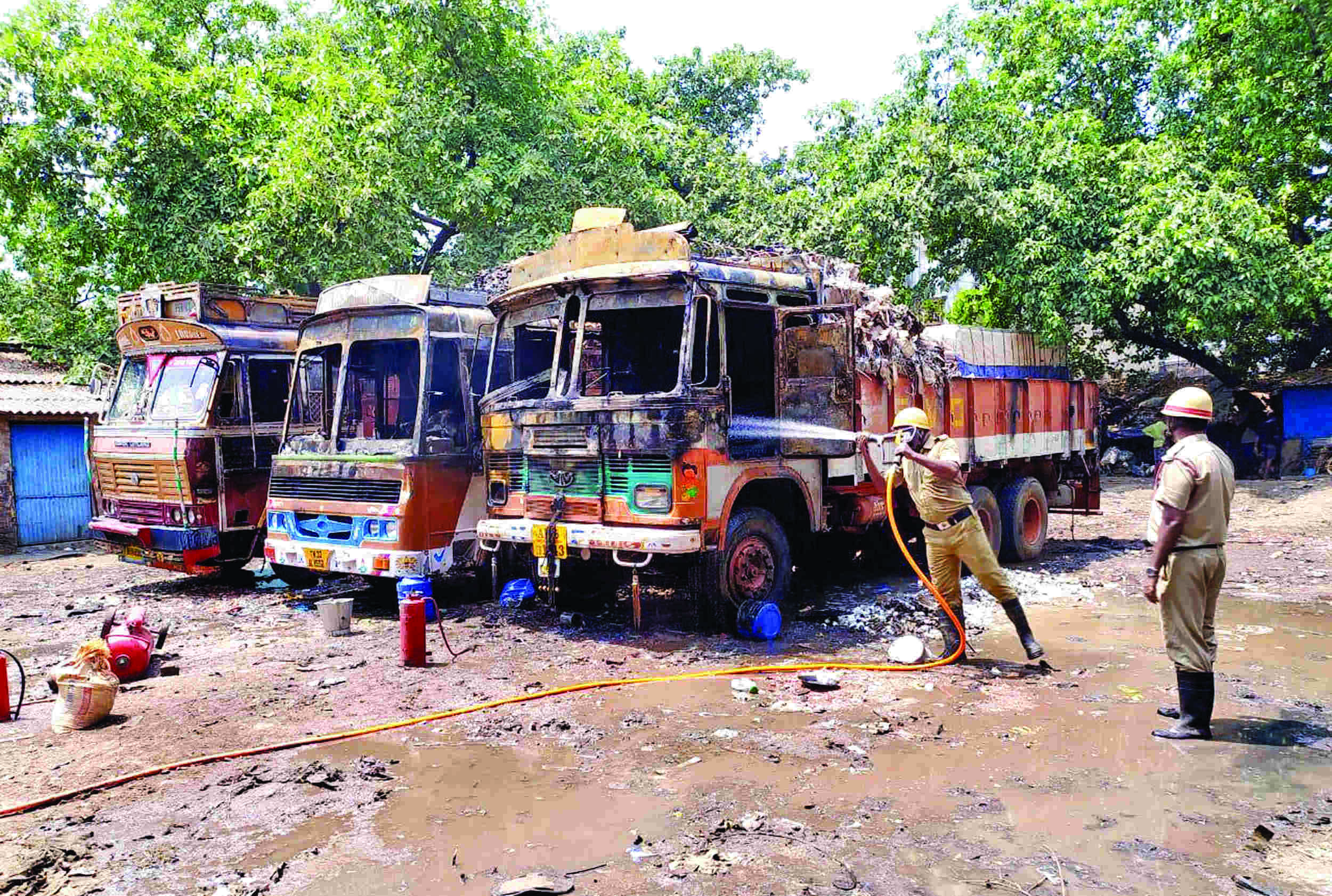 3 trucks, parked adjacent to each other near   petrol pump, catch fire