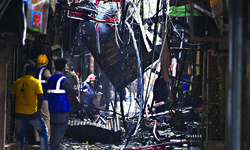 Massive fire breaks out in shoe market, several shops gutted Massive fire breaks out in shoe market, several shops gutted