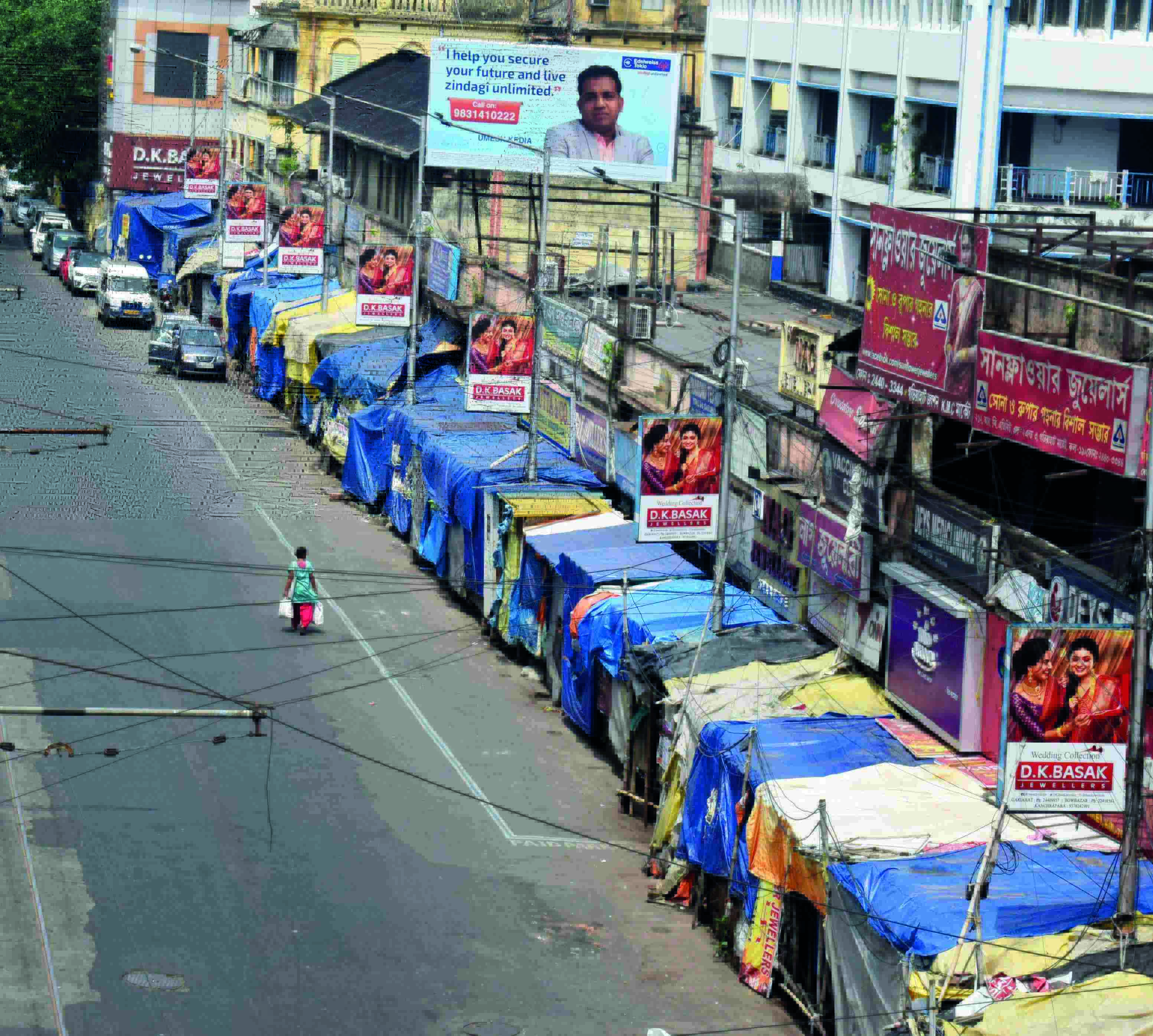 KMC to conduct raids against hawkers using plastic to cover stalls