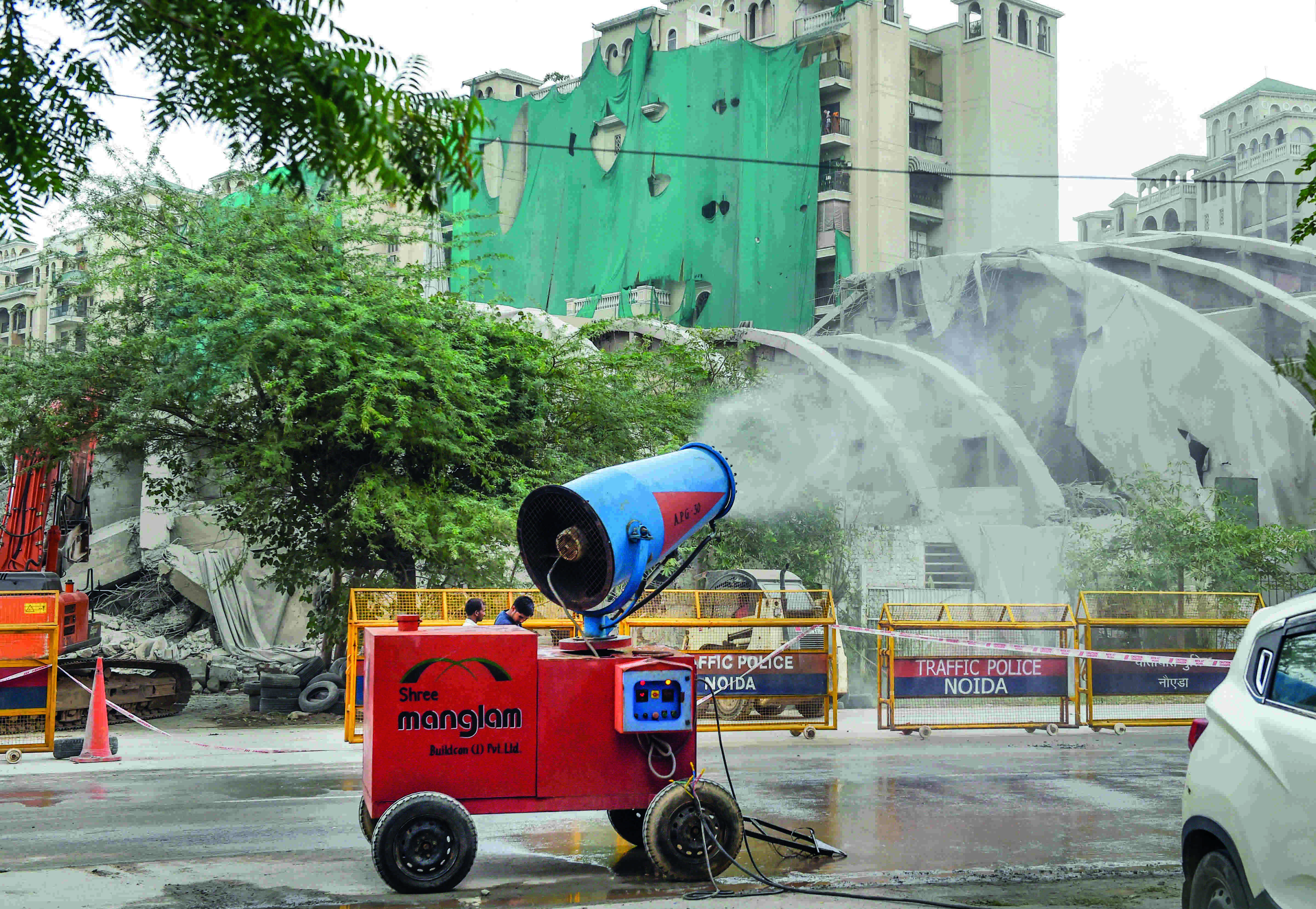 Noida twin towers: 500 workers, 100 tankers for clean up process Noida twin towers: 500 workers, 100 tankers for clean up process