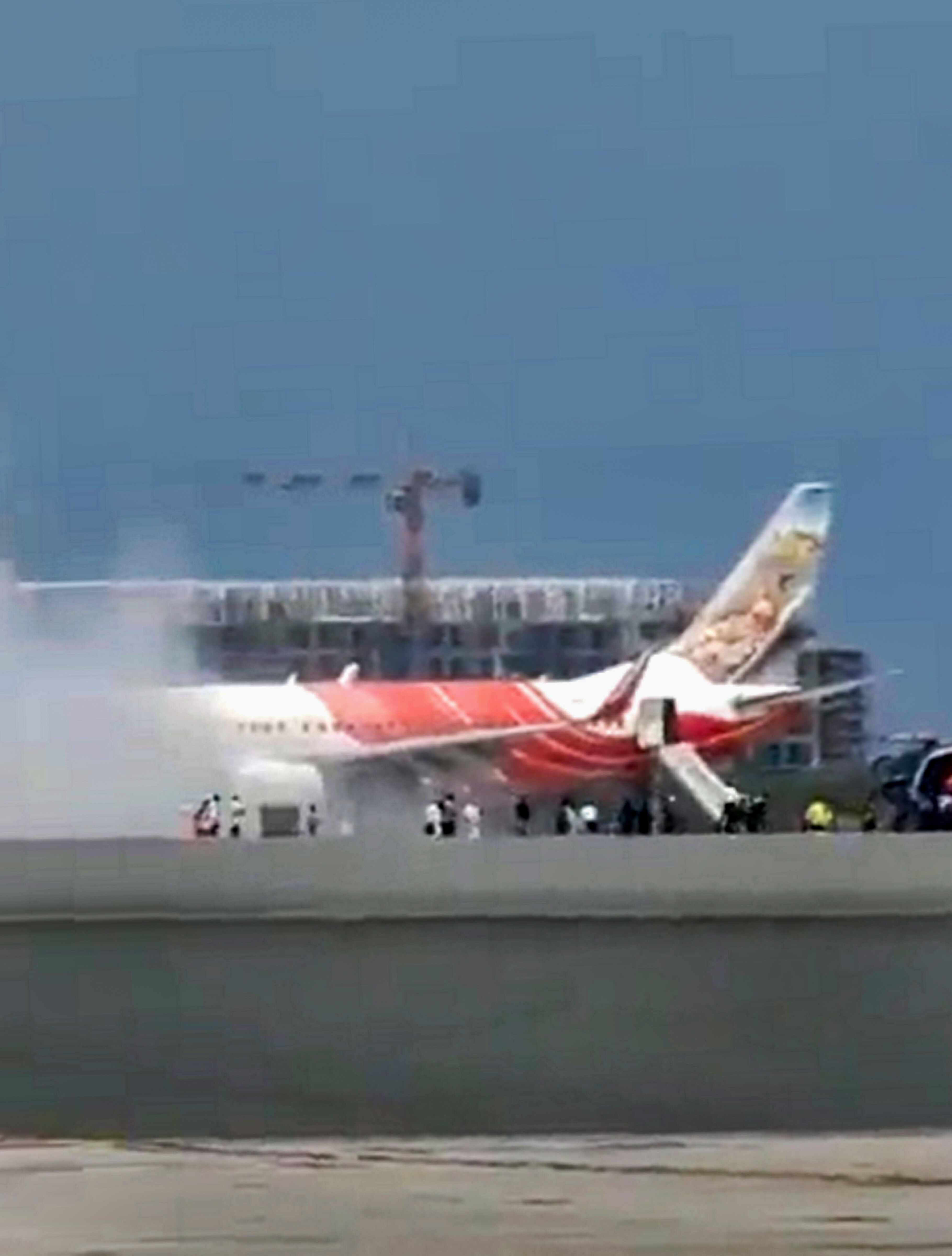 Air India Express flight catches fire at Muscat airport, passengers safe Air India Express flight catches fire at Muscat airport, passengers safe