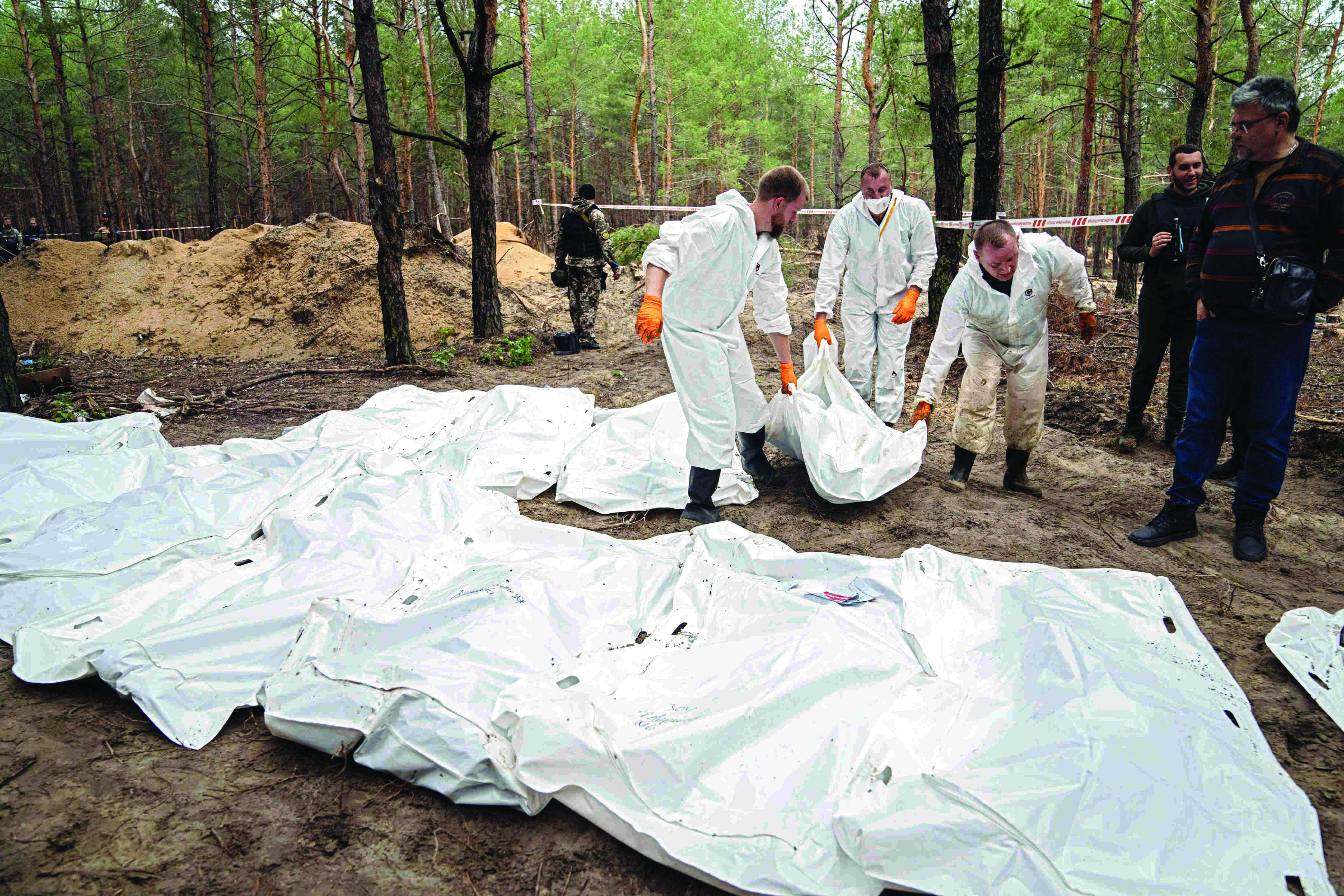 Ukraine finds new mass burials, says Russia leaves death Ukraine finds new mass burials, says Russia leaves death