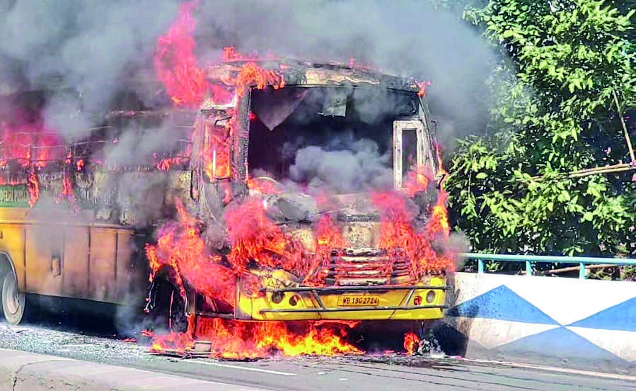 School bus catches fire on Taratala flyover, none hurt School bus catches fire on Taratala flyover, none hurt