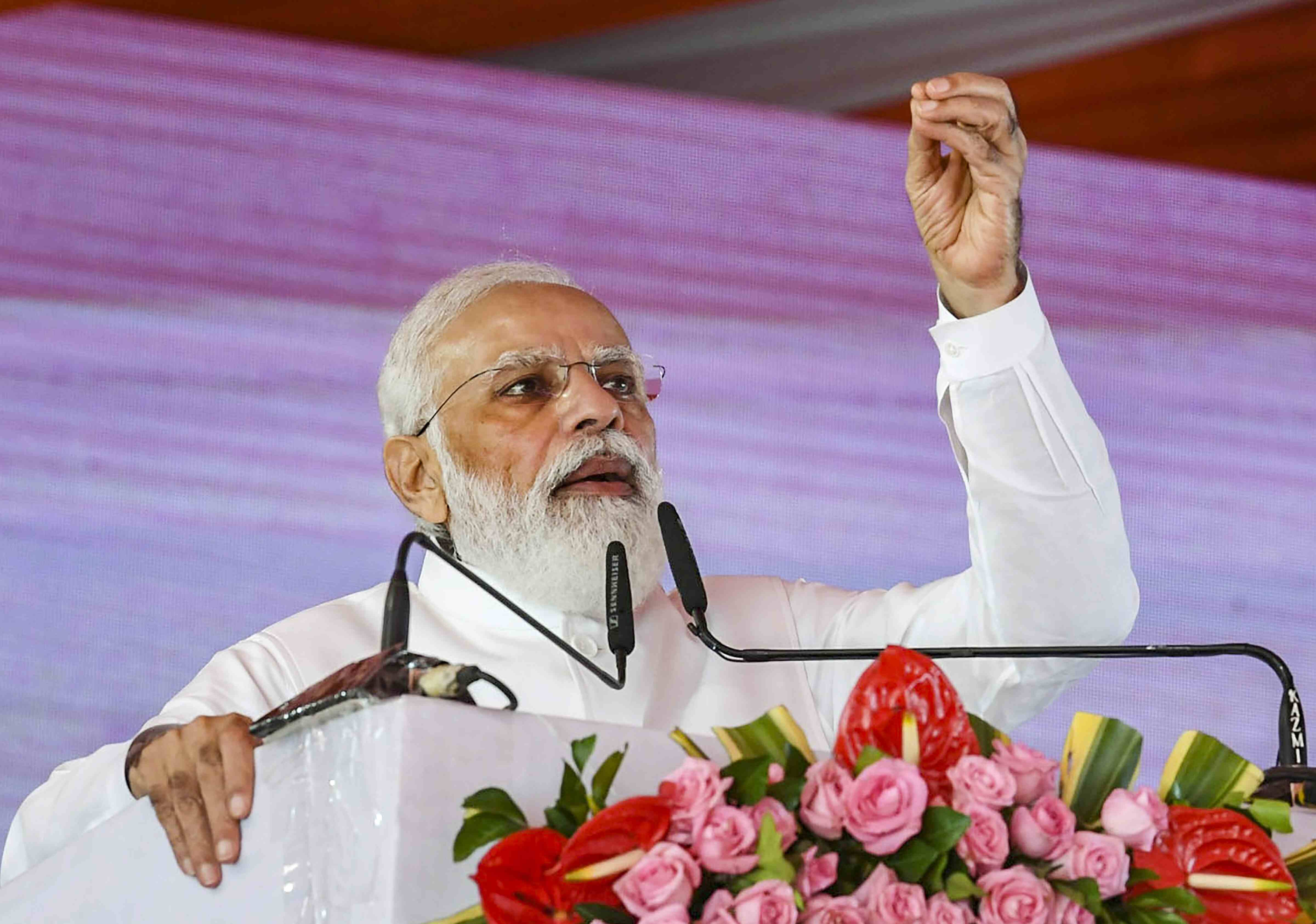 PM Modi holds roadshow in Surat, waves to people gathered to greet him