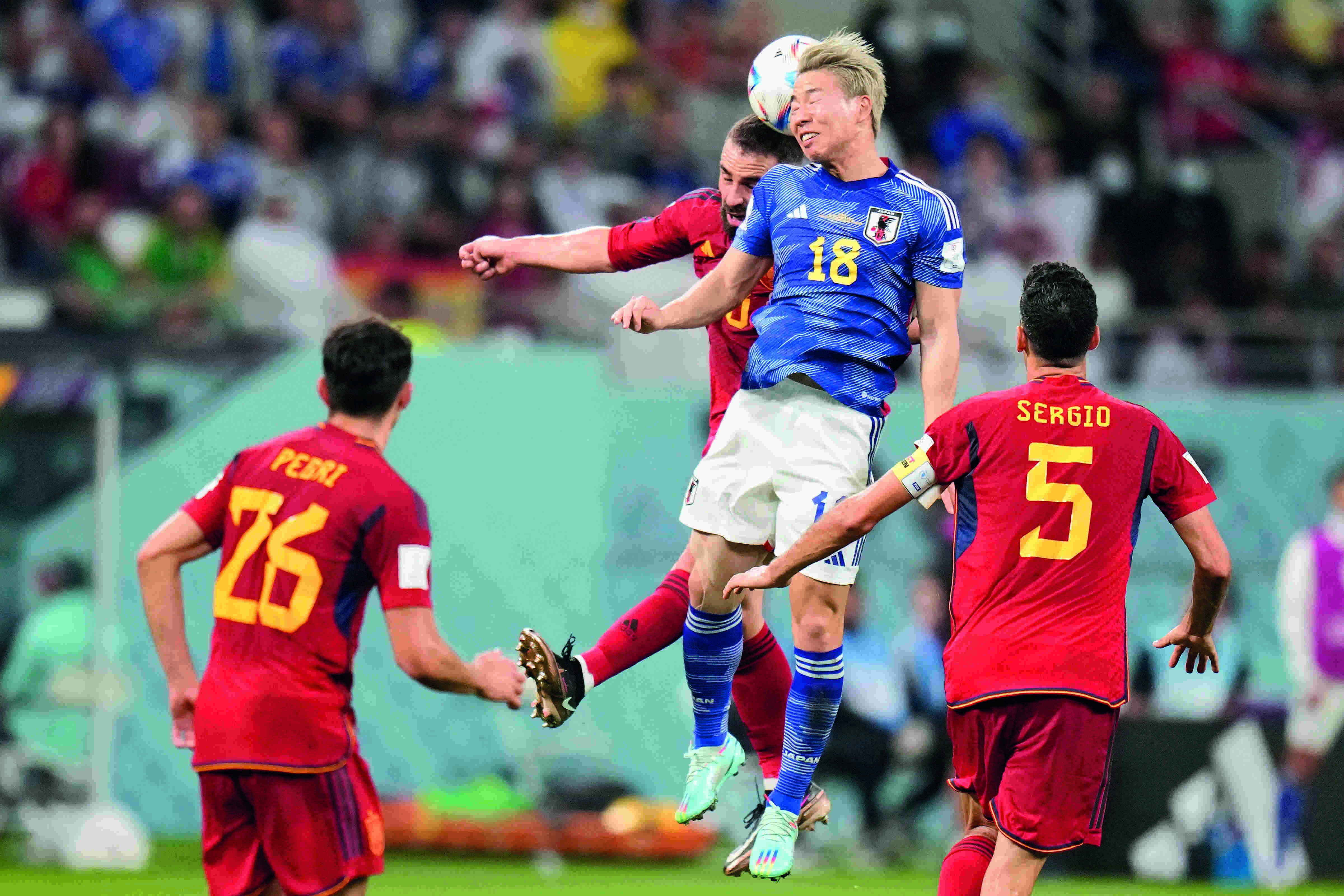 Japan beats Spain 2-1 as both teams advance at World Cup