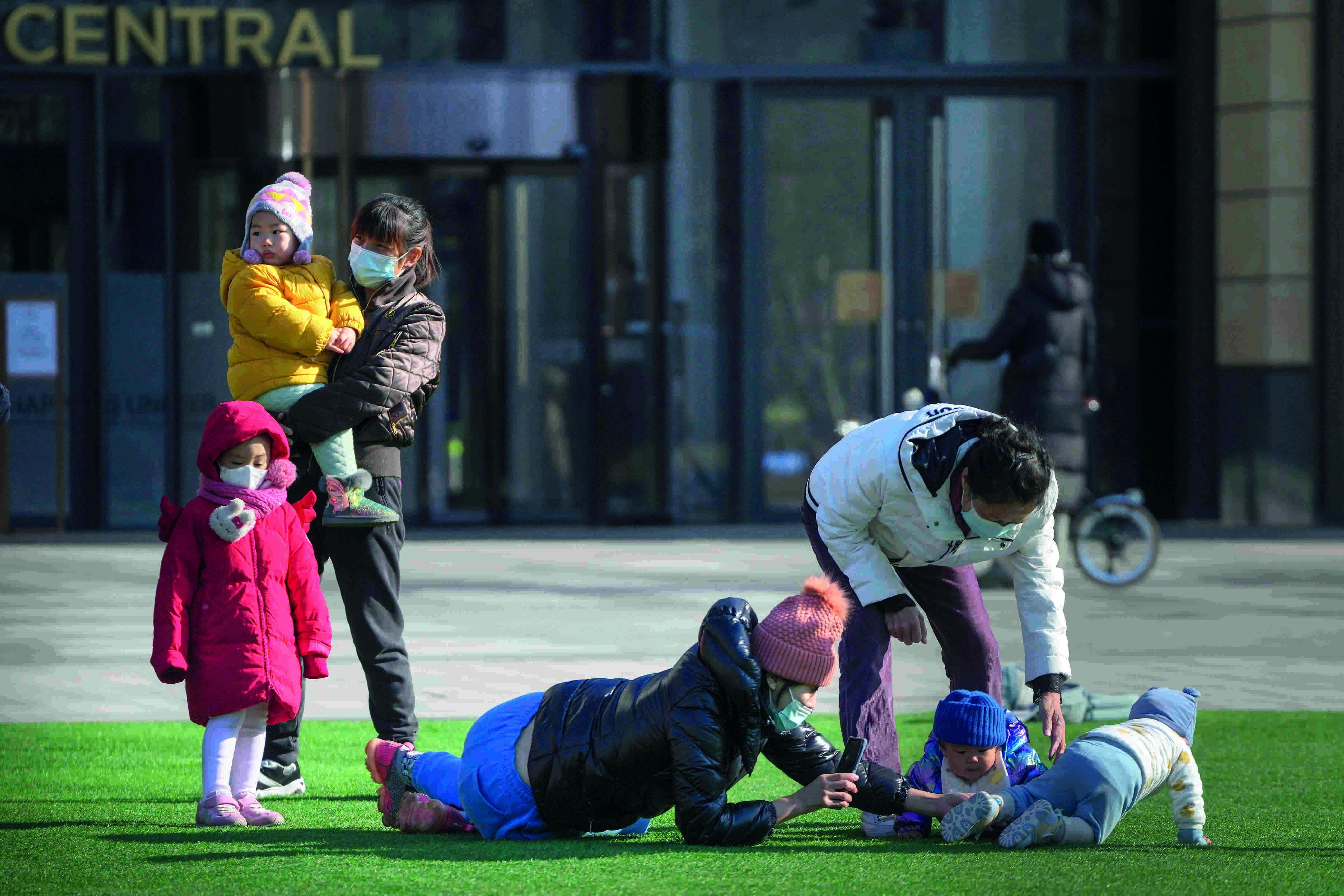 China reports 2 new Covid deaths as some curbs eased