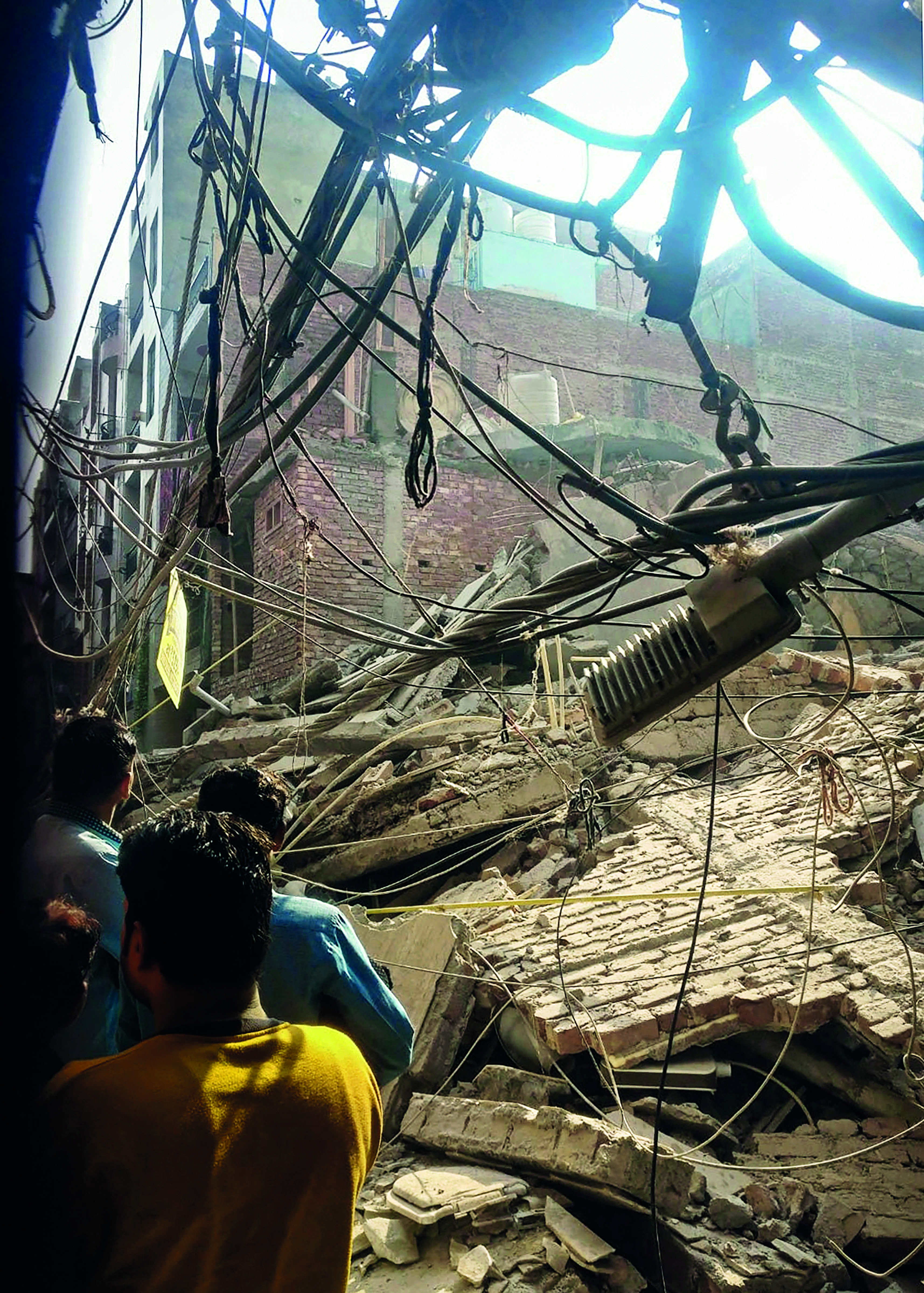 Four-storey building collapses in Delhis Shastri Nagar, no casualty Four-storey building collapses in Delhis Shastri Nagar, no casualty