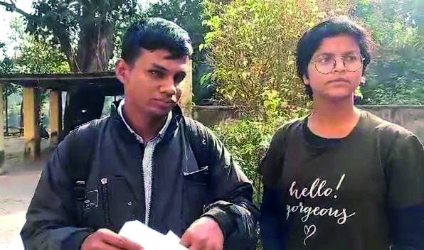 Visually impaired candidate writes paper with the help of partner