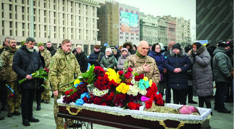 Ukrainians honour dead fighter at outdoor funeral in Kyiv