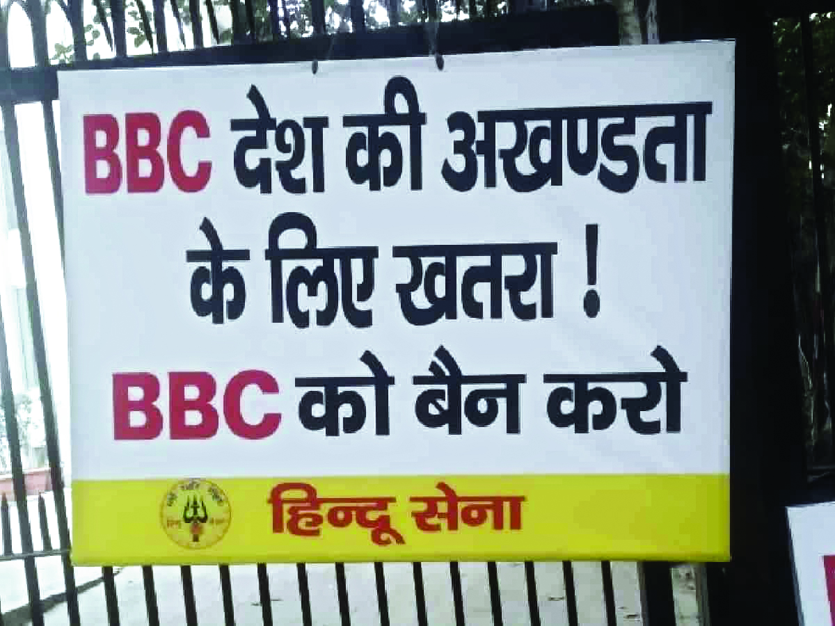 Members of Hindu Sena put up anti-BBC placards outside organisation’s Delhi office
