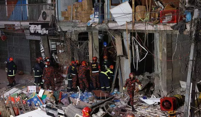 Bangladesh home minister says sufficient expertise to carry out probe into building explosion as toll rises to 18