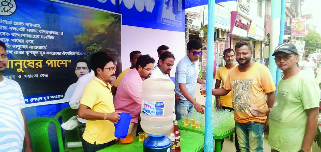 Trinamool youth wing members serve cold drinks to pedestrians