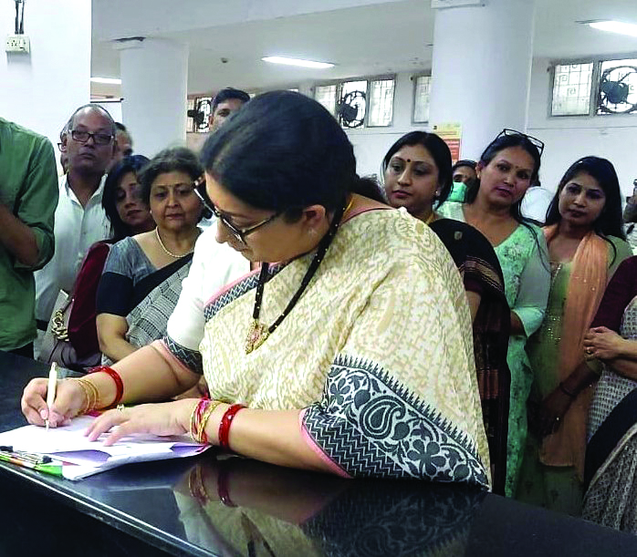 Irani visits post office to open women-centric savings account