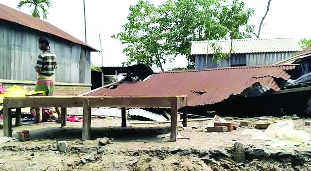 Power lines snapped, trees uprooted & houses damaged