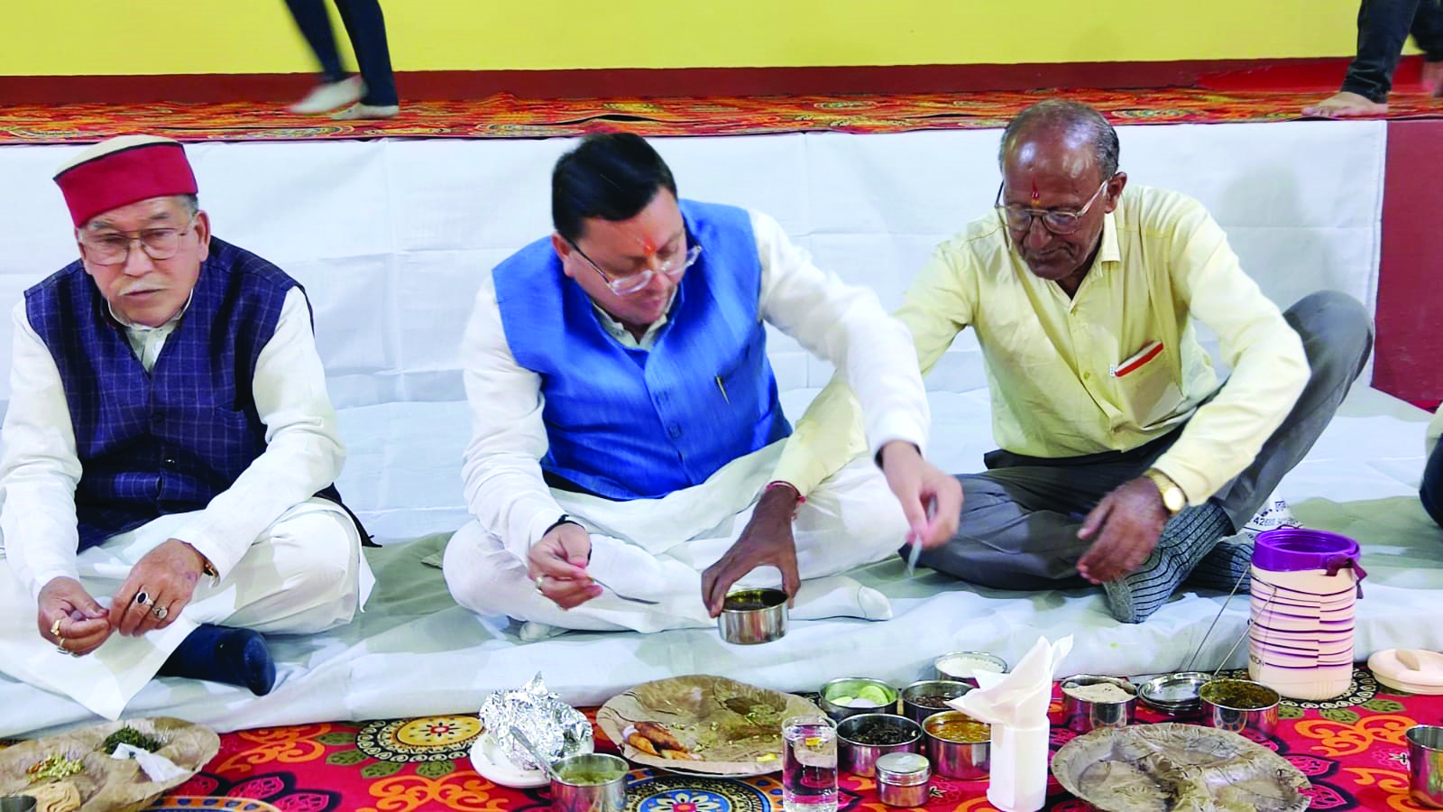 CM Dhami shares tiffin with party workers during Champawat tour CM Dhami shares tiffin with party workers during Champawat tour