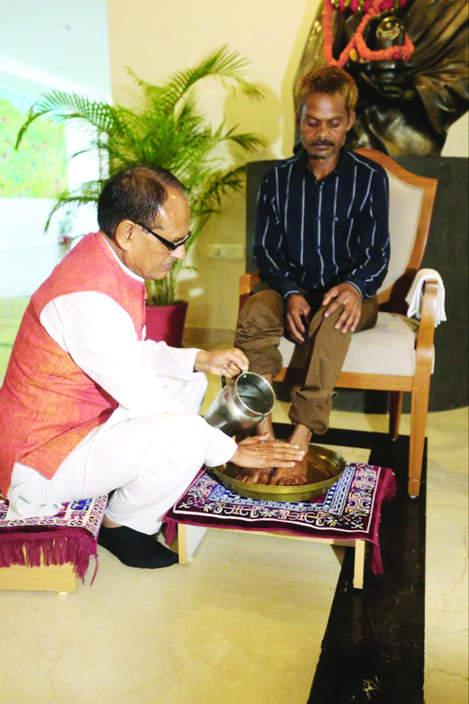 MP CM Chouhan washes feet of tribal man who was urinated on, apologises to him