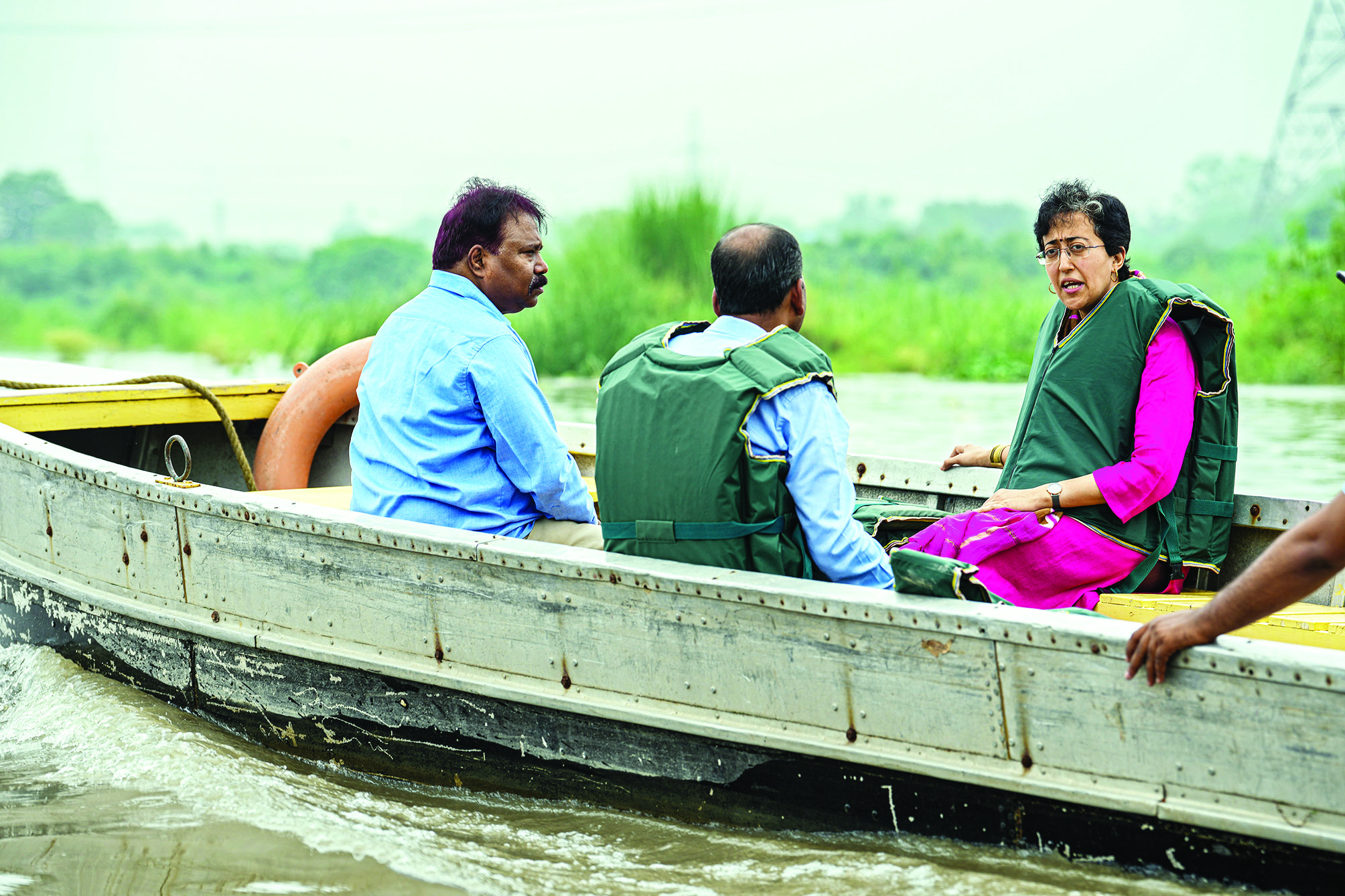 To address potential risks, Atishi inspects river via motorboat
