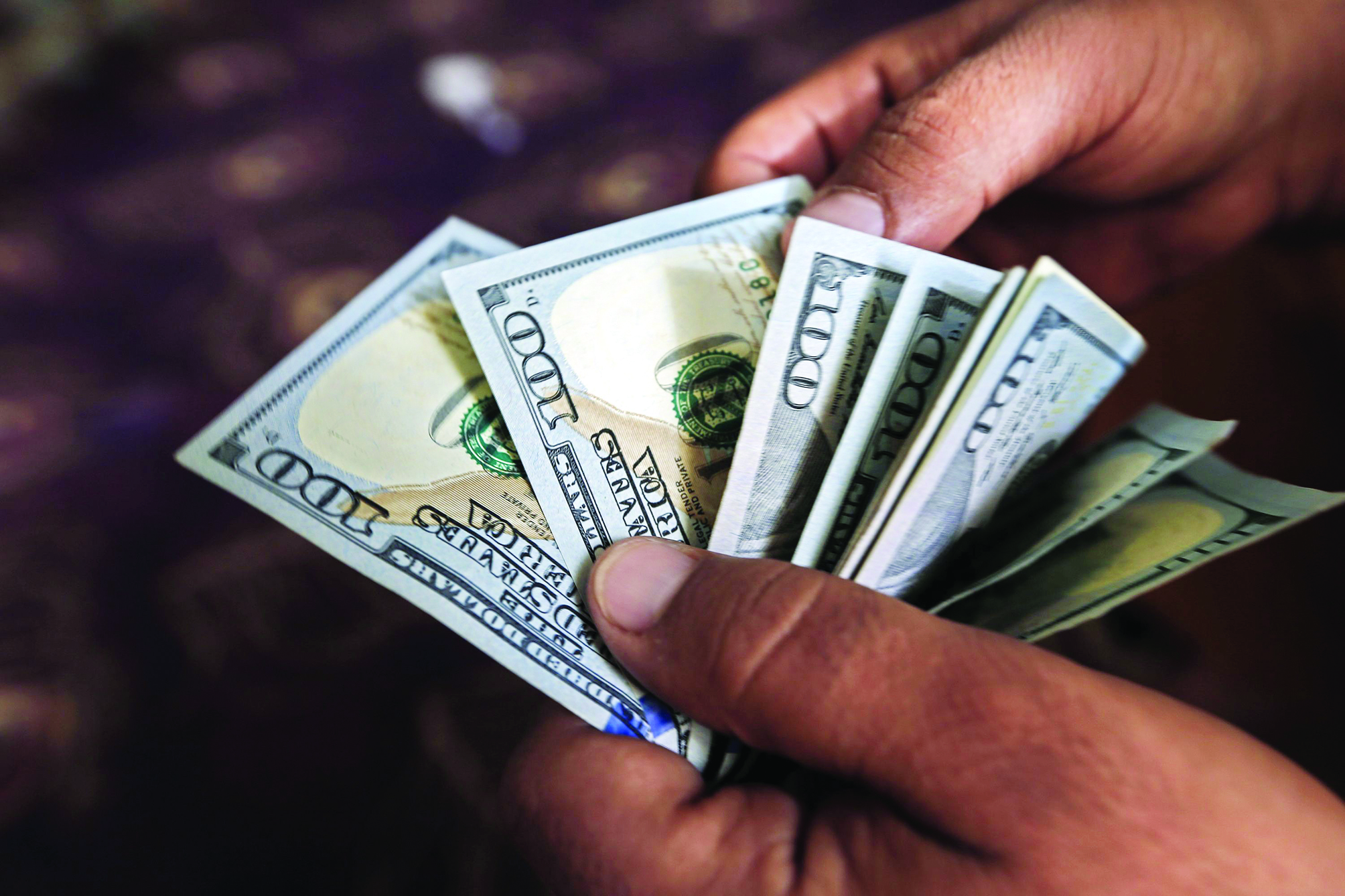 Dollar falls after inflation data upends rate outlook