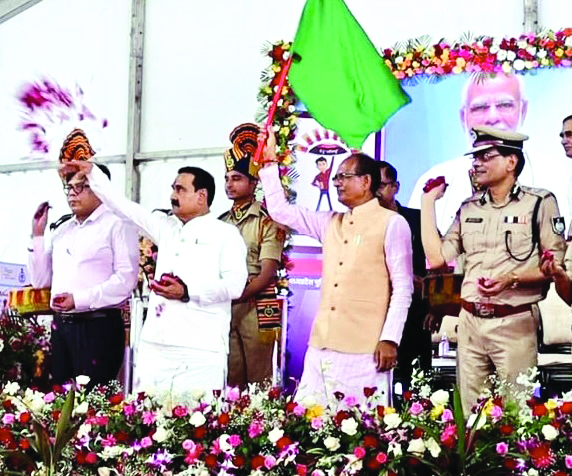 MP CM hands over scooties to women cops MP CM hands over scooties to women cops