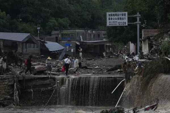 11 dead and 27 missing in flooding around Beijing after days of rain, Chinese state media report