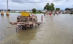 Amid Odisha floods people face shortage of drinking water as inundated roads halt tankers Amid Odisha floods people face shortage of drinking water as inundated roads halt tankers