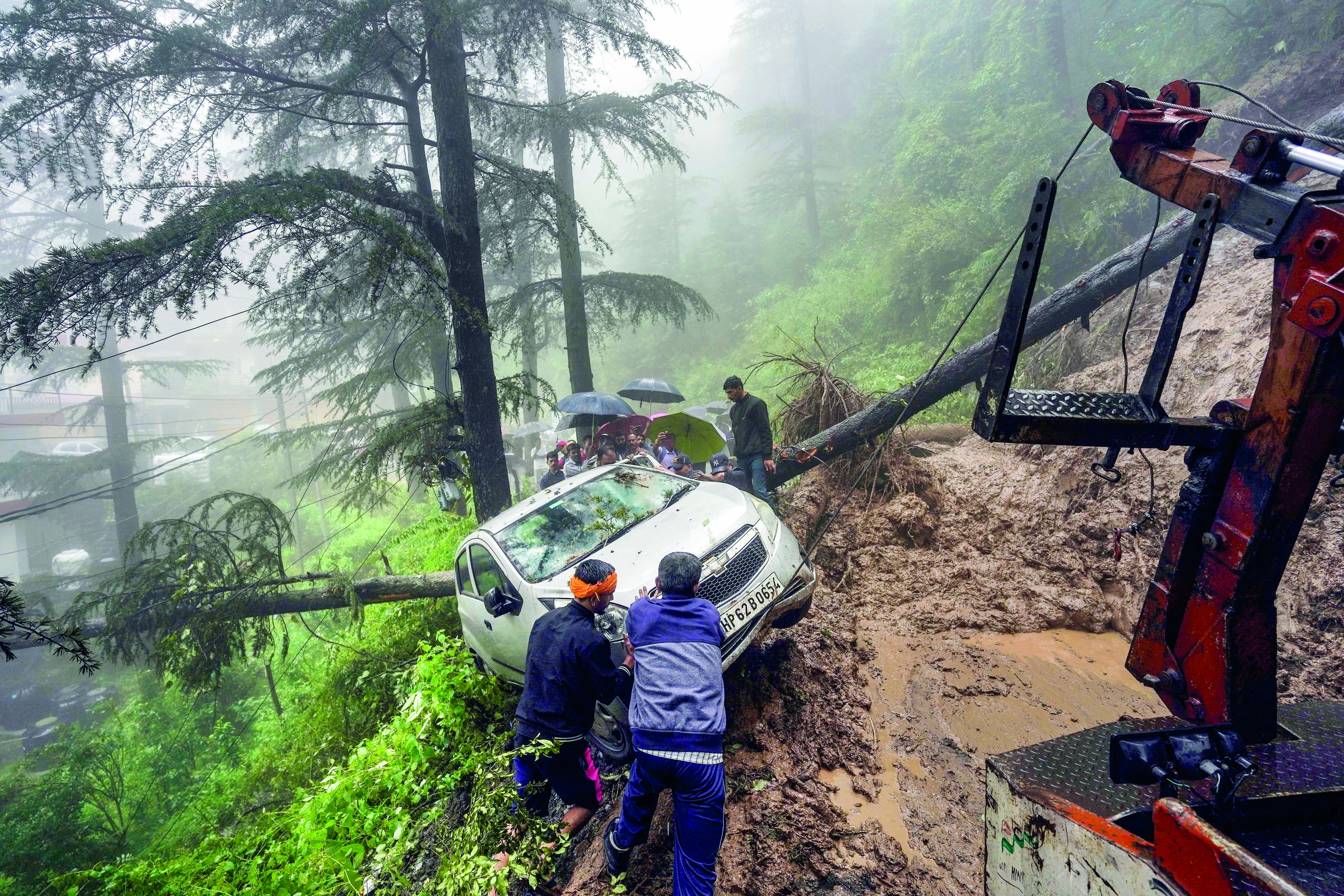 Heavy rains trigger landslides, block roads