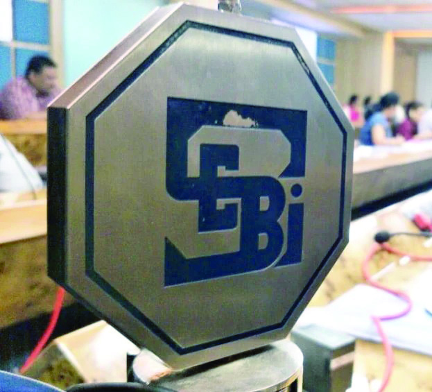 Sebi slaps Rs 2.46 crore fine on   two companies, seven individuals